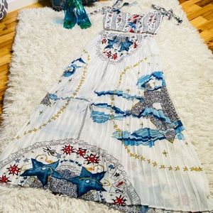 White two piece halter and pleated skirt.